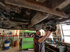 Kearney Tire & Auto Service | Mechnic under the car 2